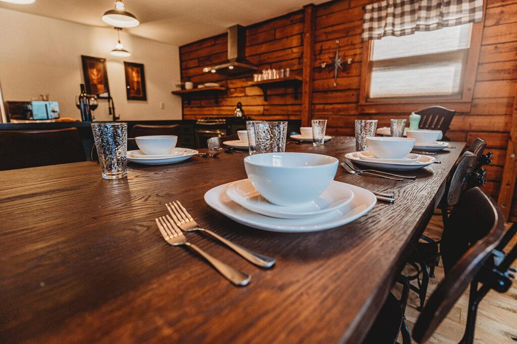 Kitchen table set with dishes ready to serve