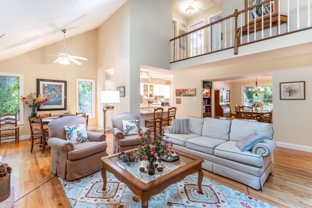 Living room with sofa, coffee table and extra seating