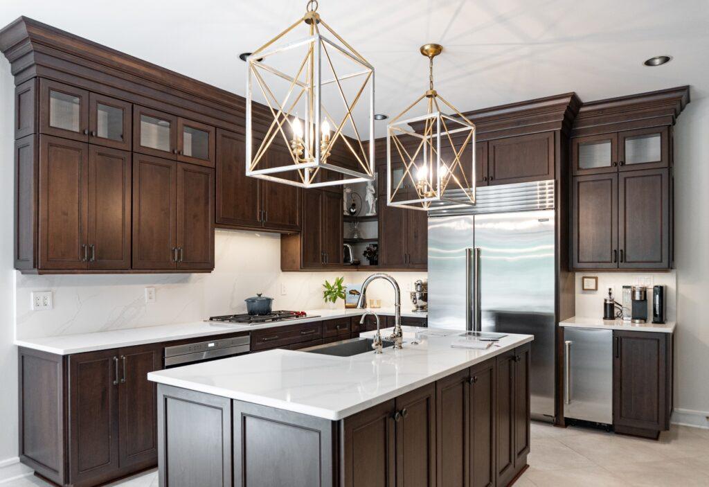 Kitchen island with pendant lighting and white countertops