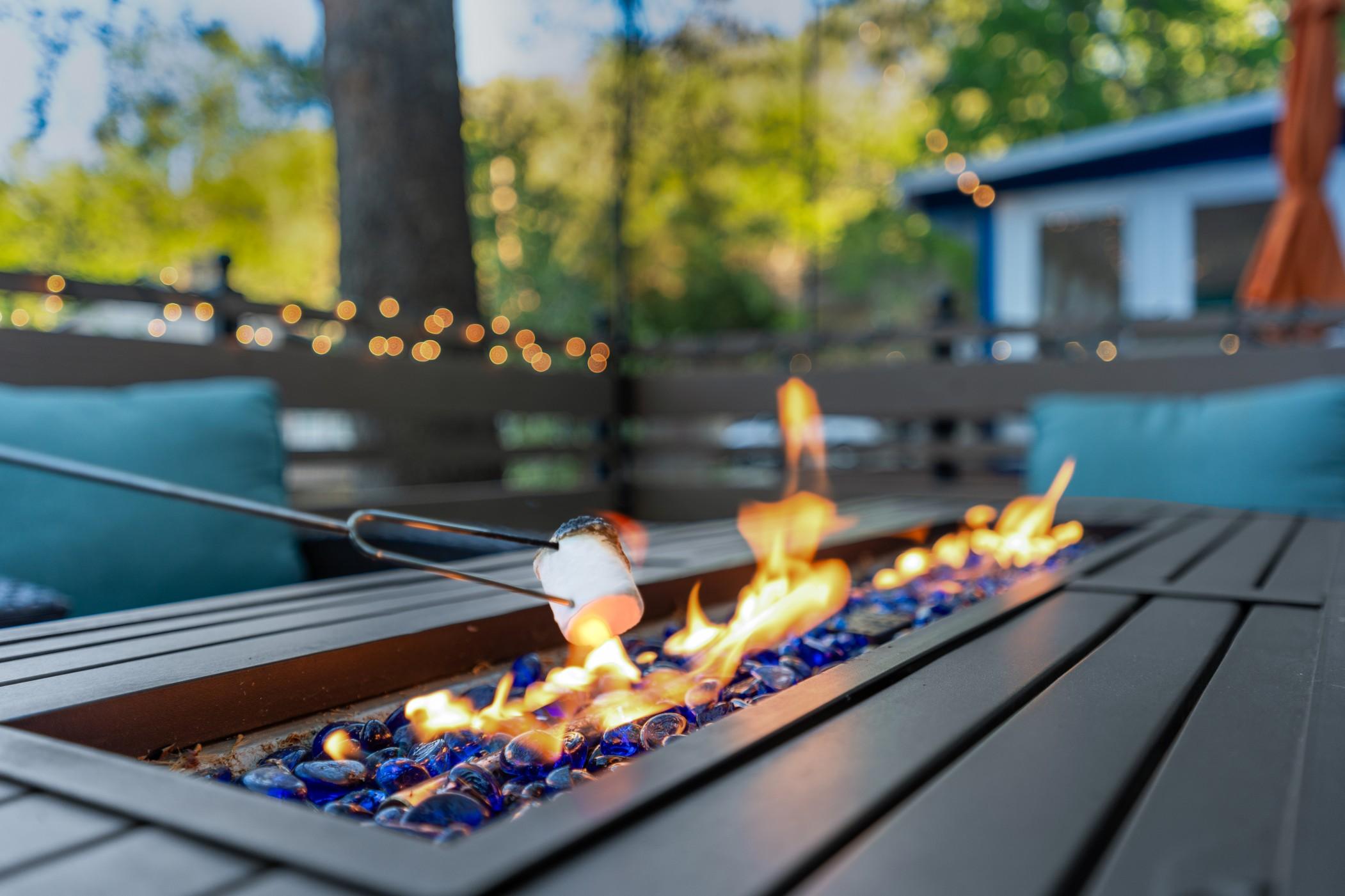 Close up of a marshmallow roasting over a flame