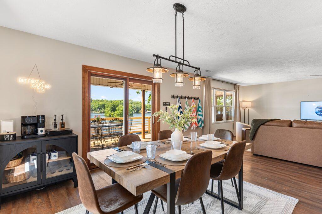 Dining room with overhead lights and a set table for six
