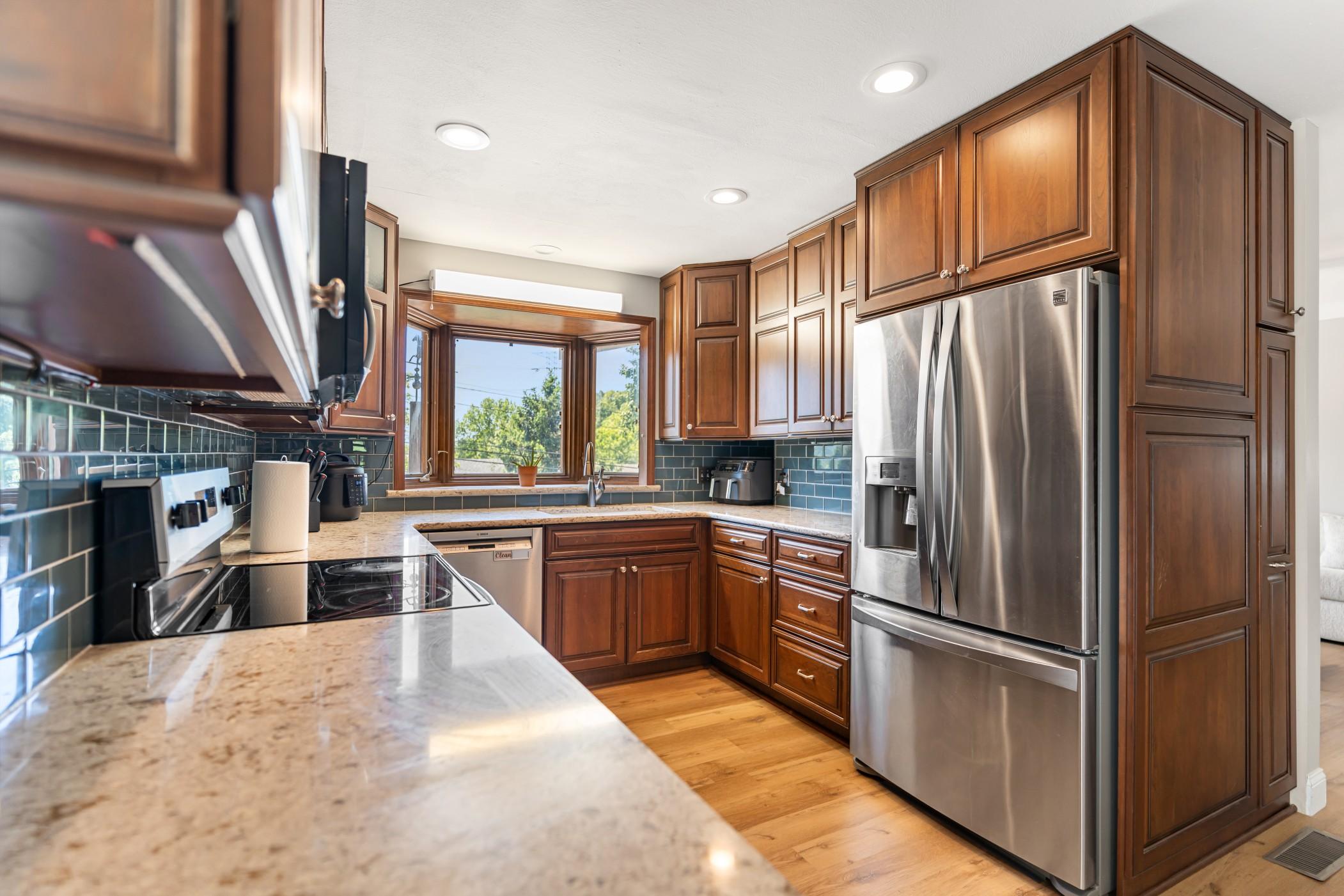 Kitchen with granite countertops and stainless steel appliances