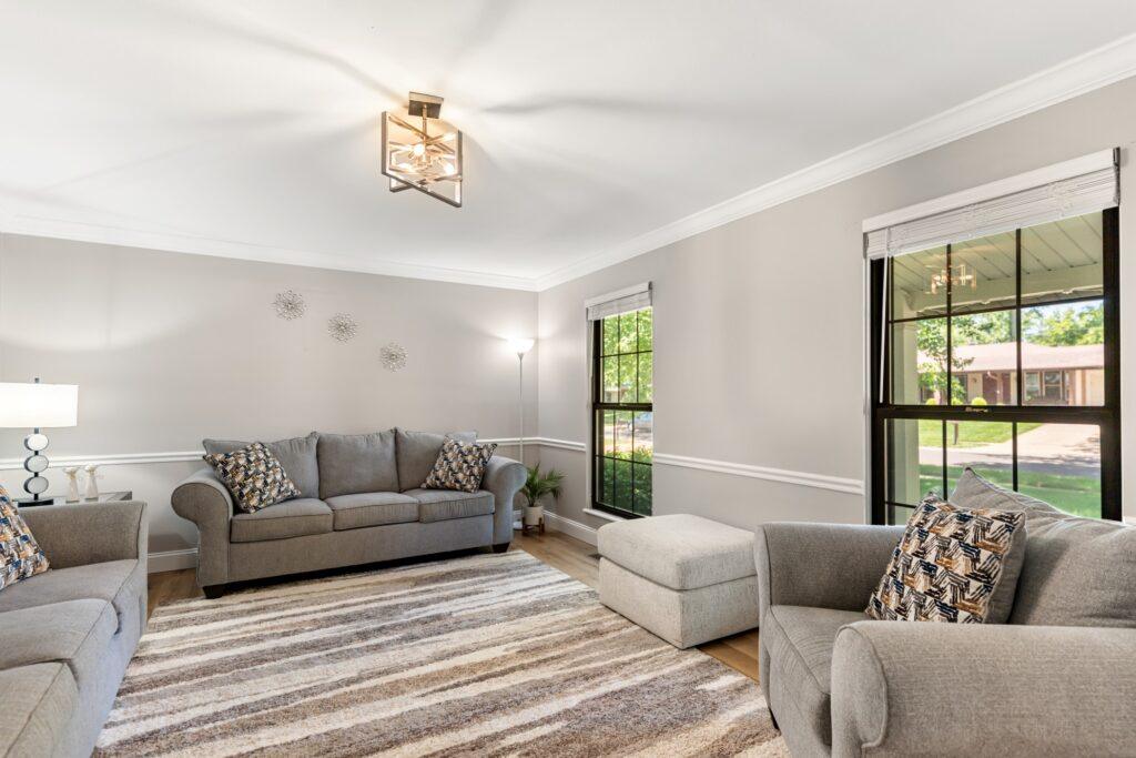Living room with multiple couches and chairs