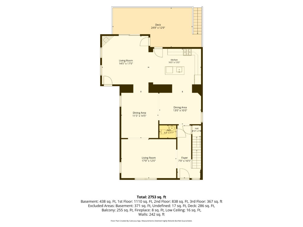 2D Floor Plan of a house featuring two living rooms, two dining rooms, a kitchen, foyer, bathroom, stairs, and a deck.